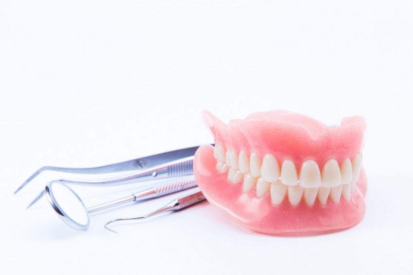 Make your loose dentures fit better at Tuxedo Dental Group