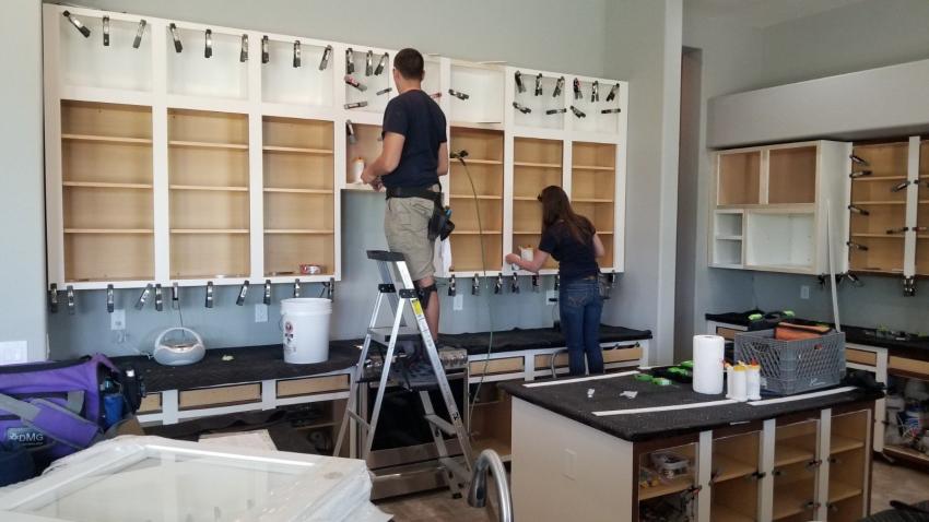 How Cabinet Refinishers Tackle Water Damage & Warped Doors